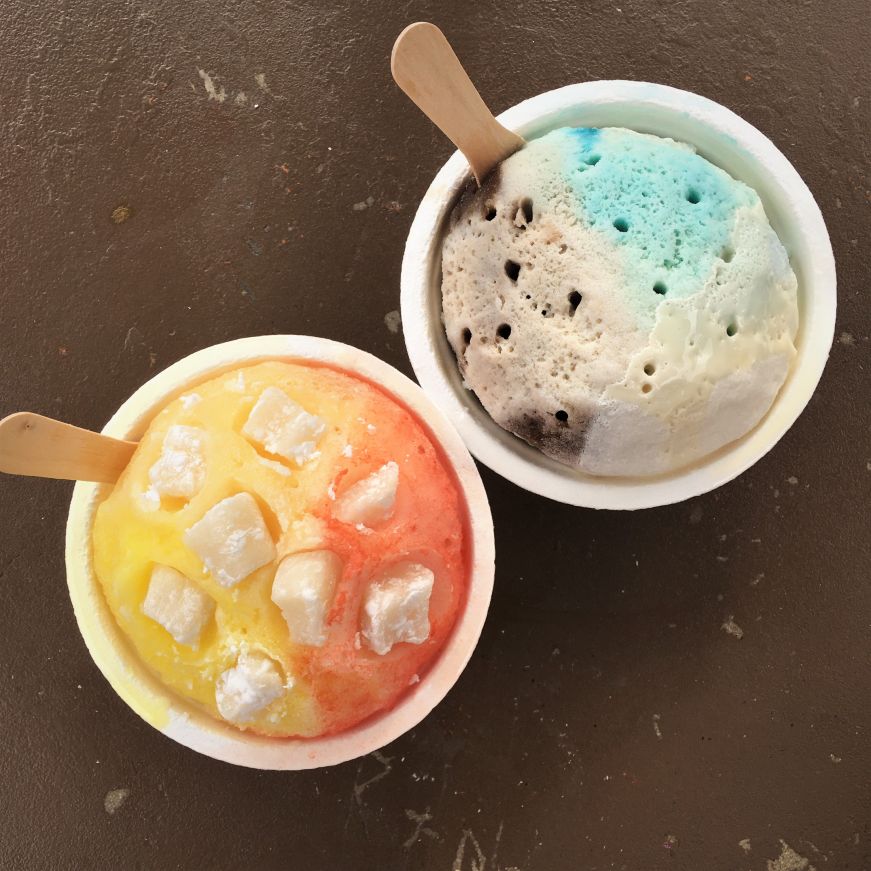 Top down view of two cups of multi-colored shave ice, Ululani's Shave Ice, Lahaina, Maui