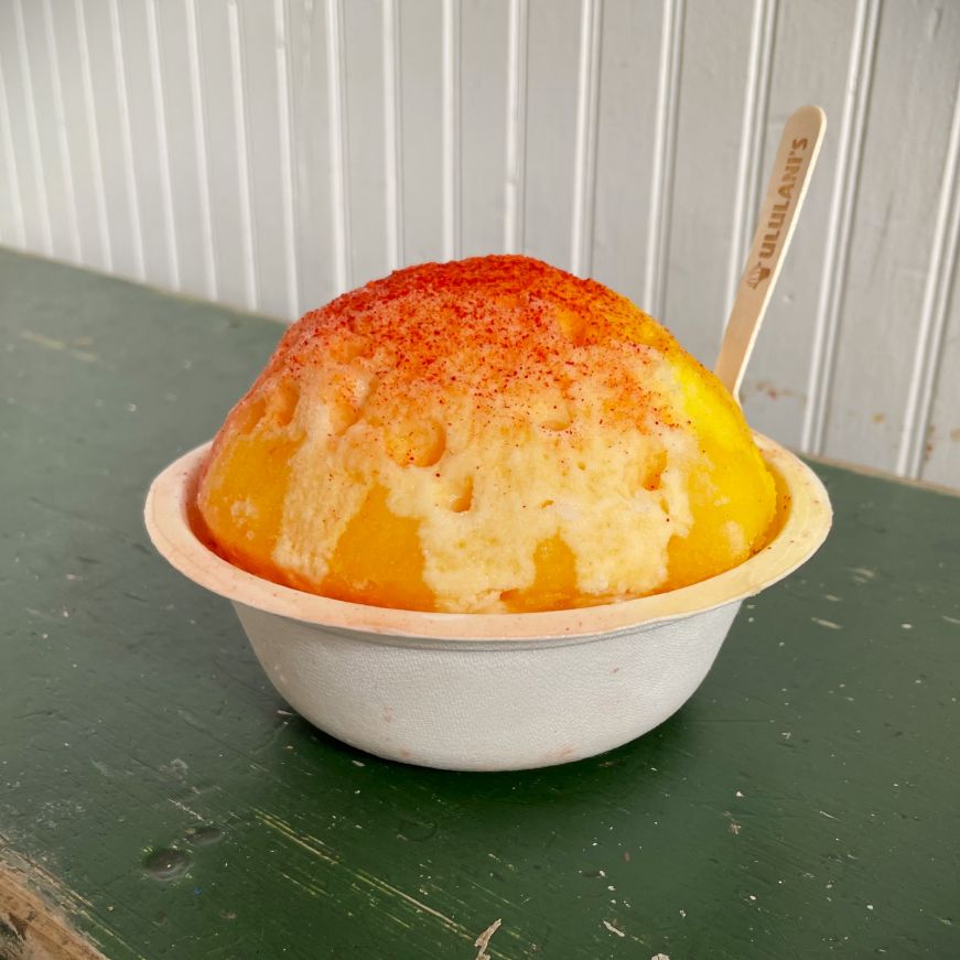 Ululani's Hawaiian Shave Ice, Sunset Beach with li hing mui powder and snow cap Cup of shave ice topped with li hing mui powder