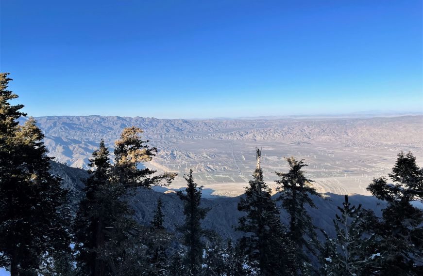Panoramic view of mountains with a bright blue sky