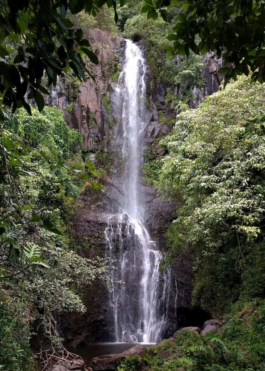 Large waterfall tumbling down a rock wall