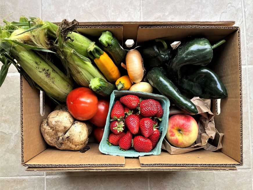 Box filled with fruits and vegetables