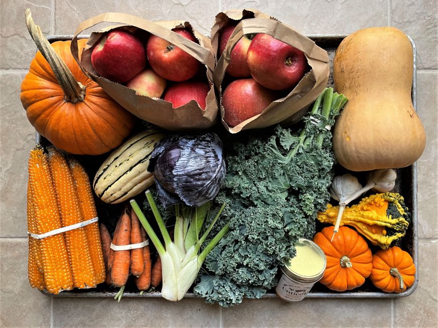 Large baking sheet with produce arranged on it