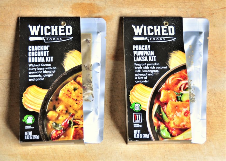 Two meal kits consisting of foil pouches and plastic bags with seasonings
