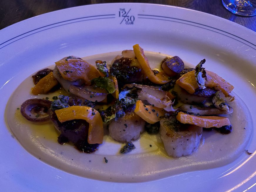 Plate of scallops, roasted squash slices, and potato puree