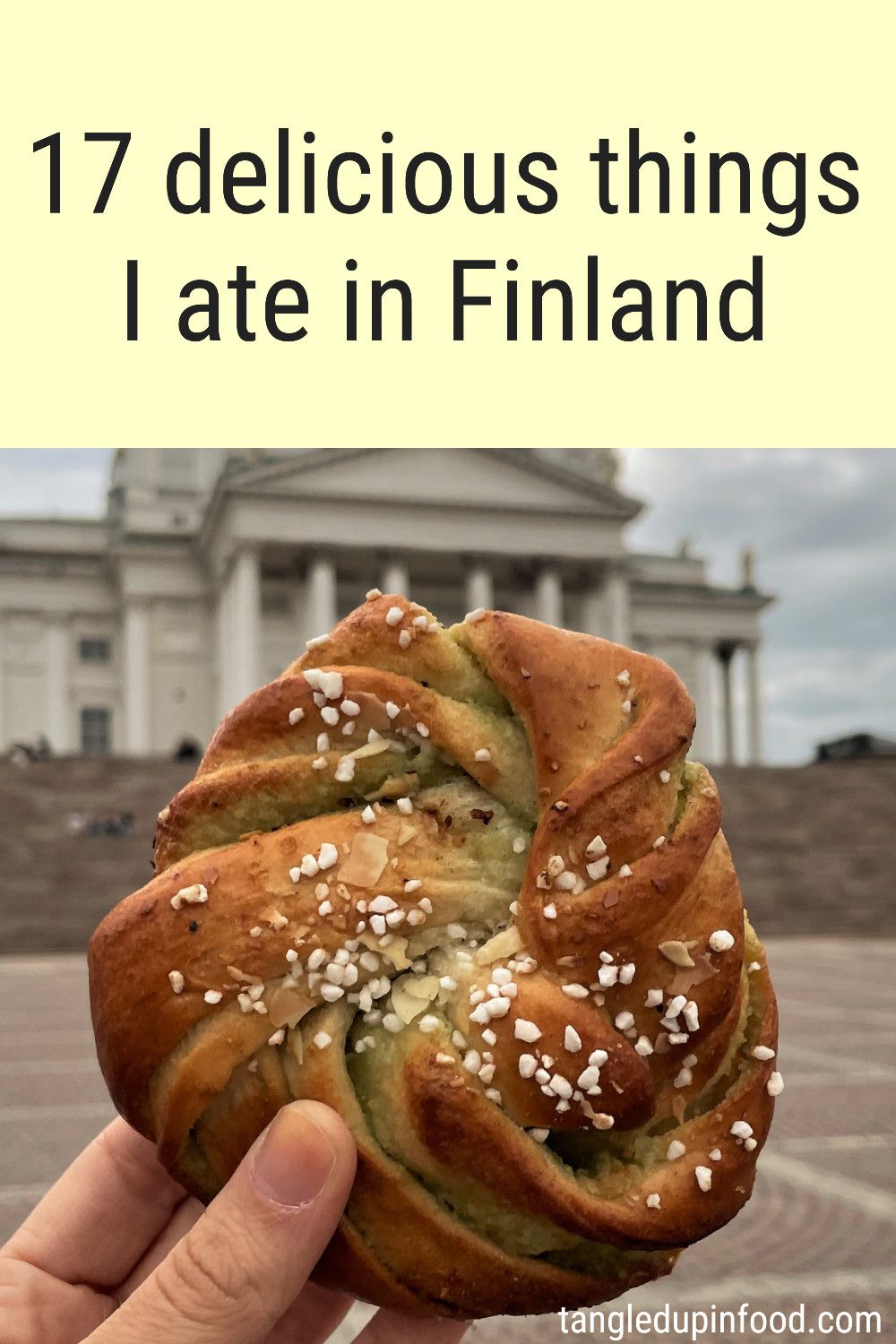 Hand holding pastry in front of Helsinki Cathedral and text reading "17 delicious things I ate in Finland"