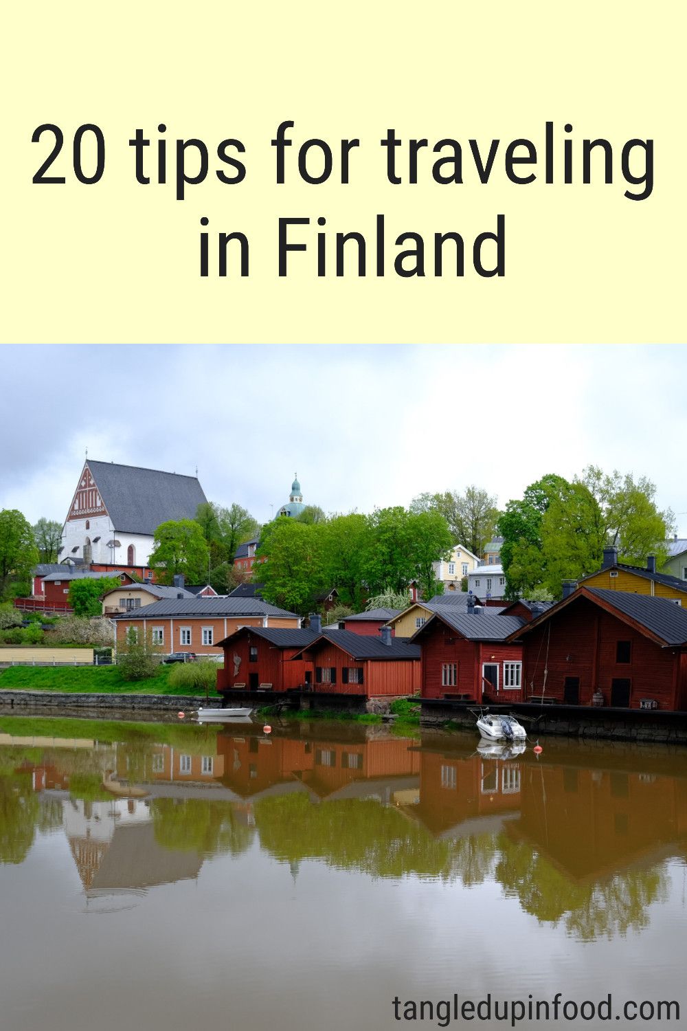Photo of red wooden buildings along a river and text reading "20 tips for traveling in Finland"