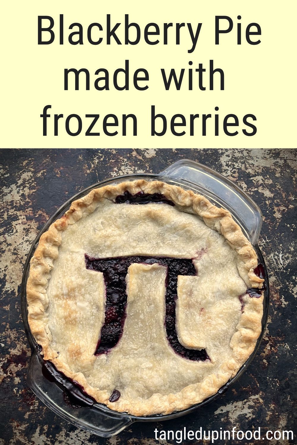 Photo of blackberry pie with a pi symbol cut into the top crust and text reading "Blackberry pie made with frozen berries"