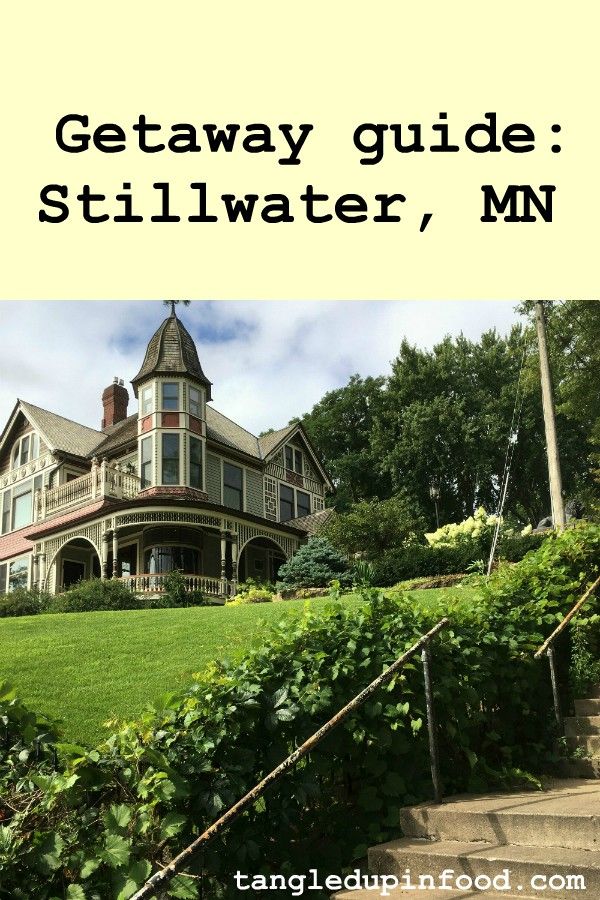 Queen Anne-style mansion and cement steps with text reading "Getaway guide: Stillwater, MN"