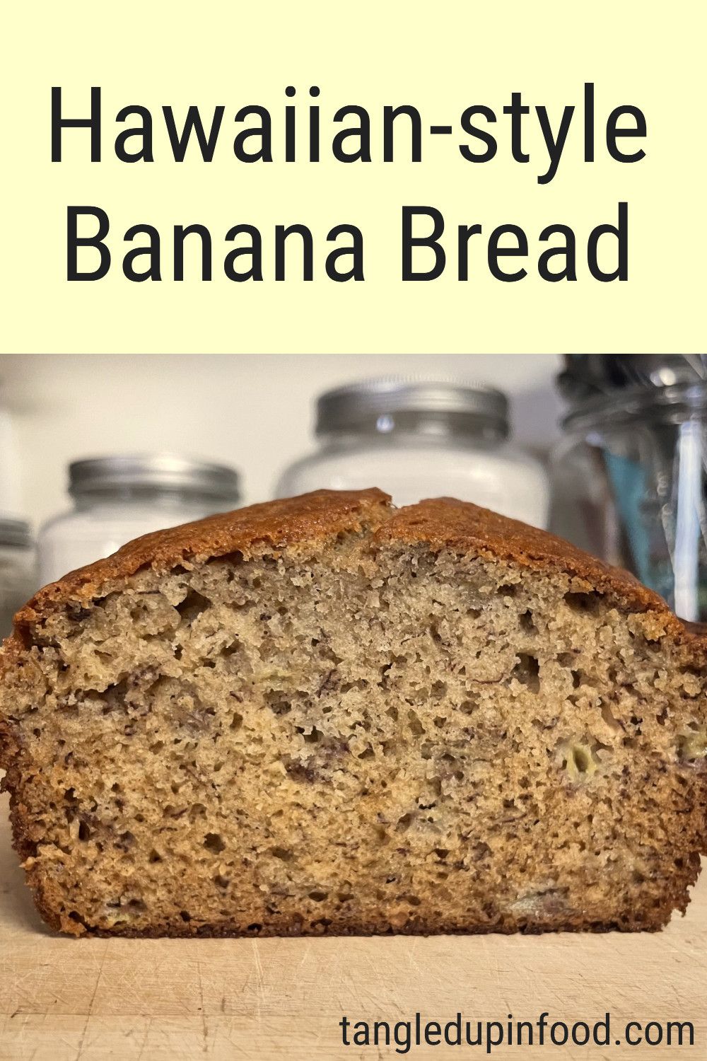 Photo of a cross section of loaf of banana bread with text reading "Hawaiian-style Banana Bread"