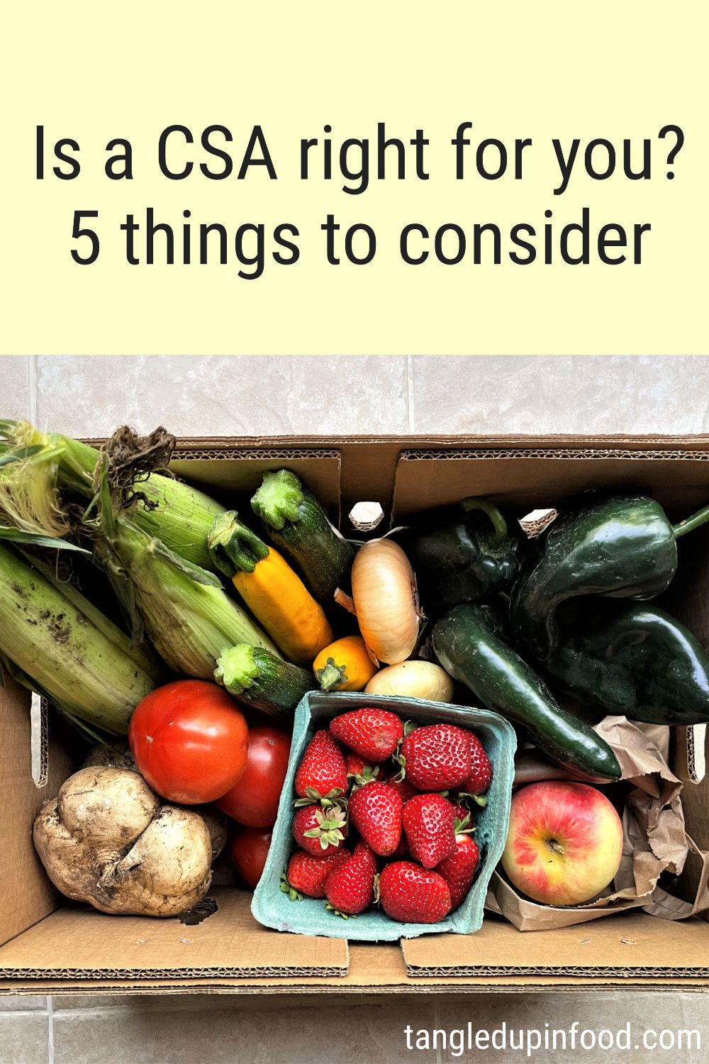 Box of produce with text reading "Is a CSA right for you? 5 things to consider"