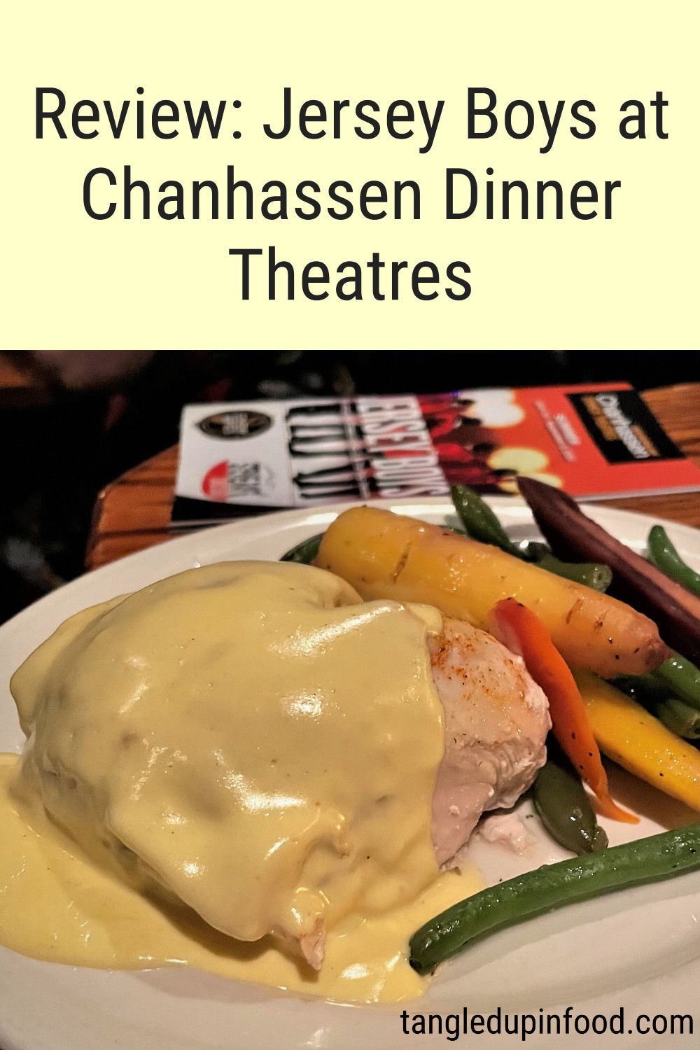 Photo of chicken breast covered with hollandaise sauce with text reading "Review: Jersey Boys at Chanhassen Dinner Theatres"