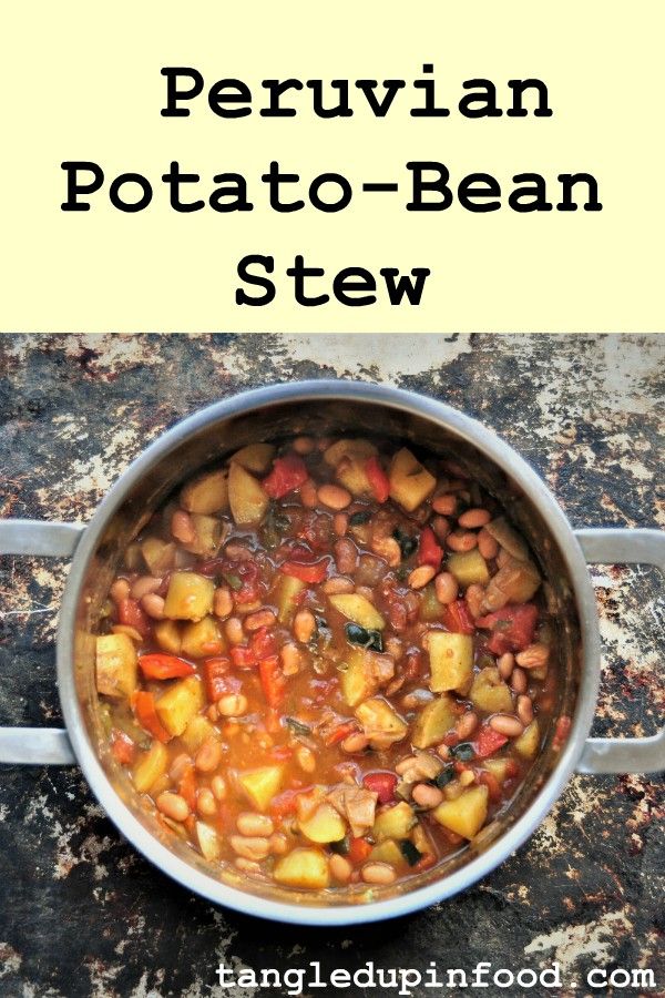 Top down view of pot of stew with text reading "Peruvian Potato-Bean Stew"