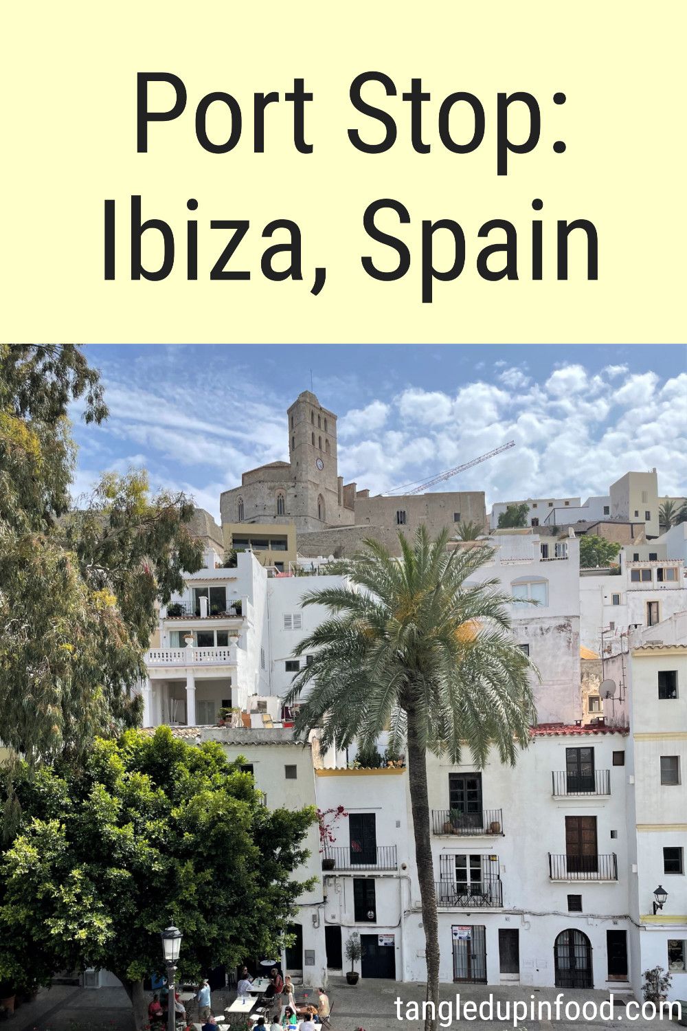 Photo of cathedral and palm tree with text reading "Port Stop: Ibiza, Spain"