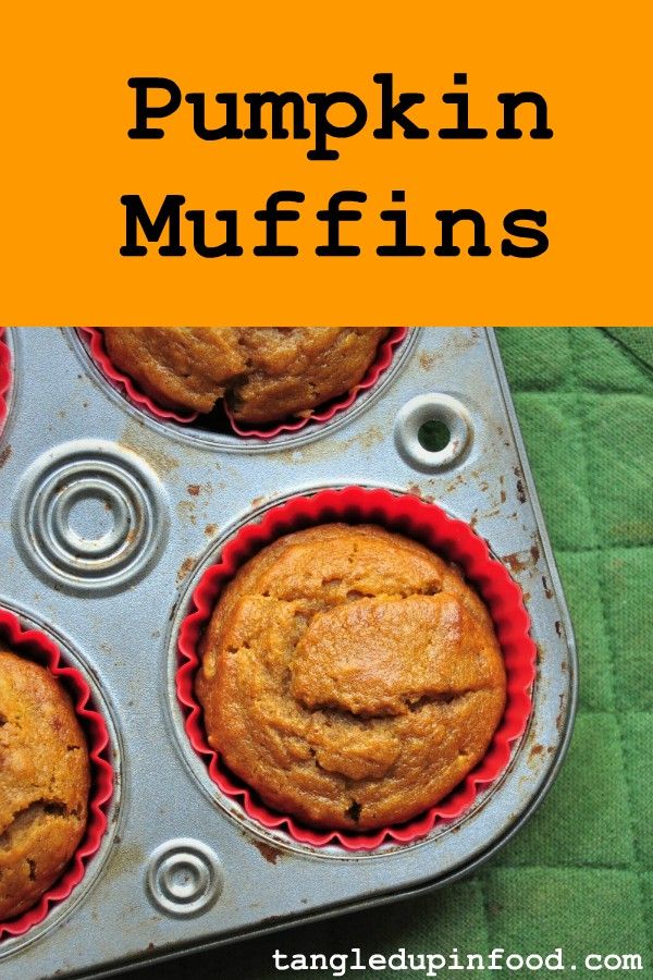 Pumpkin muffins in tin with text reading "Pumpkin Muffins"