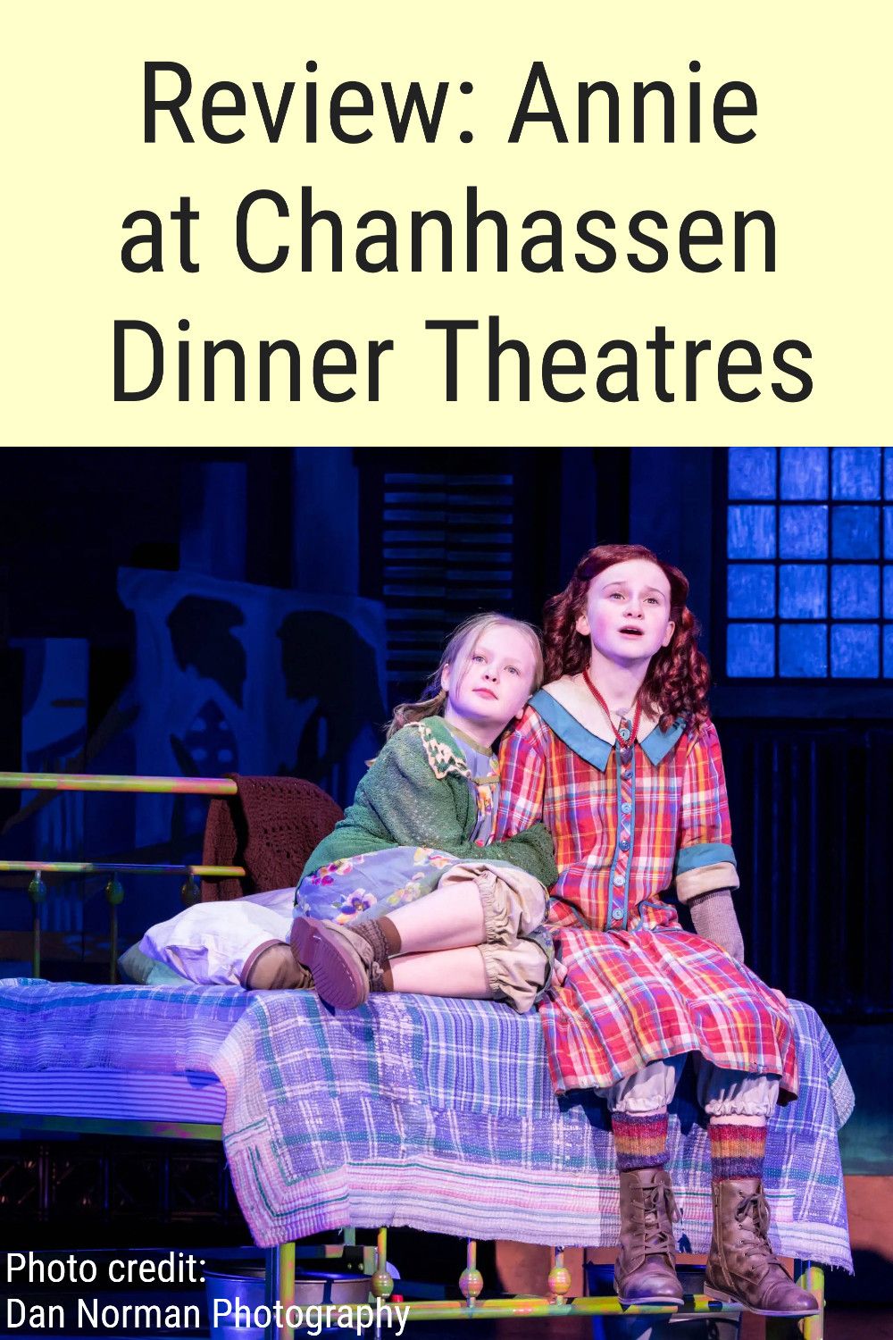 Photo of two girls sitting on a bed and text reading "Review: Annie at Chanhassen Dinner Theatres"