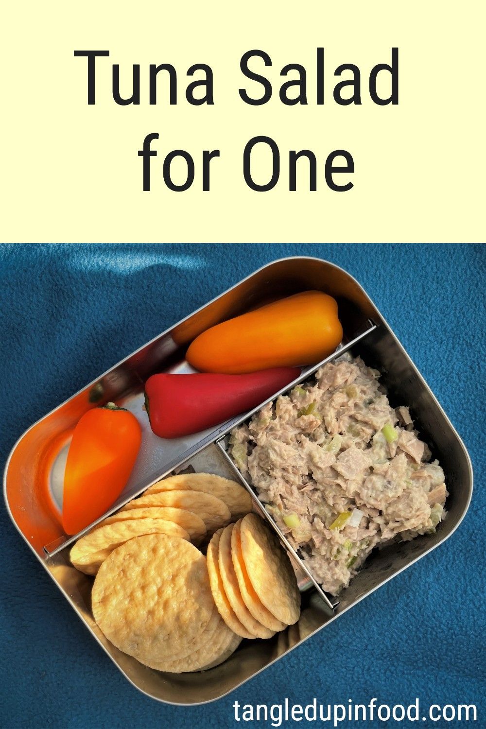 Glass bowl with tuna salad and text reading "Tuna Salad for One"