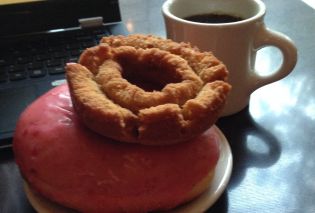 The tools of a food blogger's craft: doughnuts, coffee, and a laptop