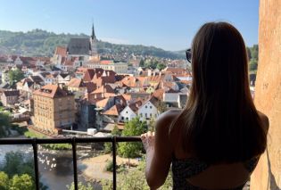 Stacy looking out over a medieval-era town
