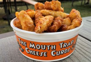 Plastic bucket filled with deep fried cheese curds