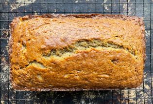 Top down view of a loaf of banana bread on a wire rack