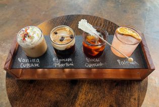 Flight of four miniature iced coffee drinks