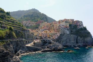 Seaside town of colorful buildings built into a cliff