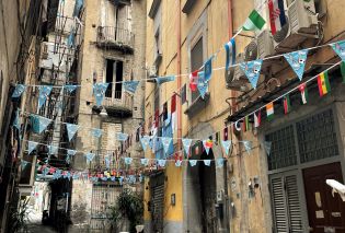 Narrow alley with streamers overhead