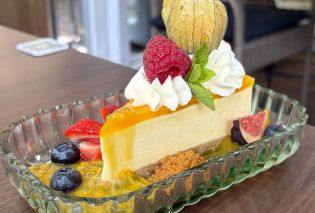 Cheesecake surround by fresh fruit garnishes
