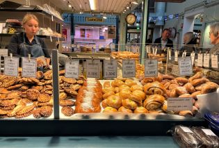 Bakery stall with case filled with savory and sweet pastries