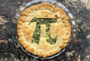 Spinach feta pie with a pi symbol cut out of the top crust
