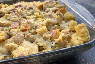 Stuffing made with white bread and corn bread in a glass baking dish